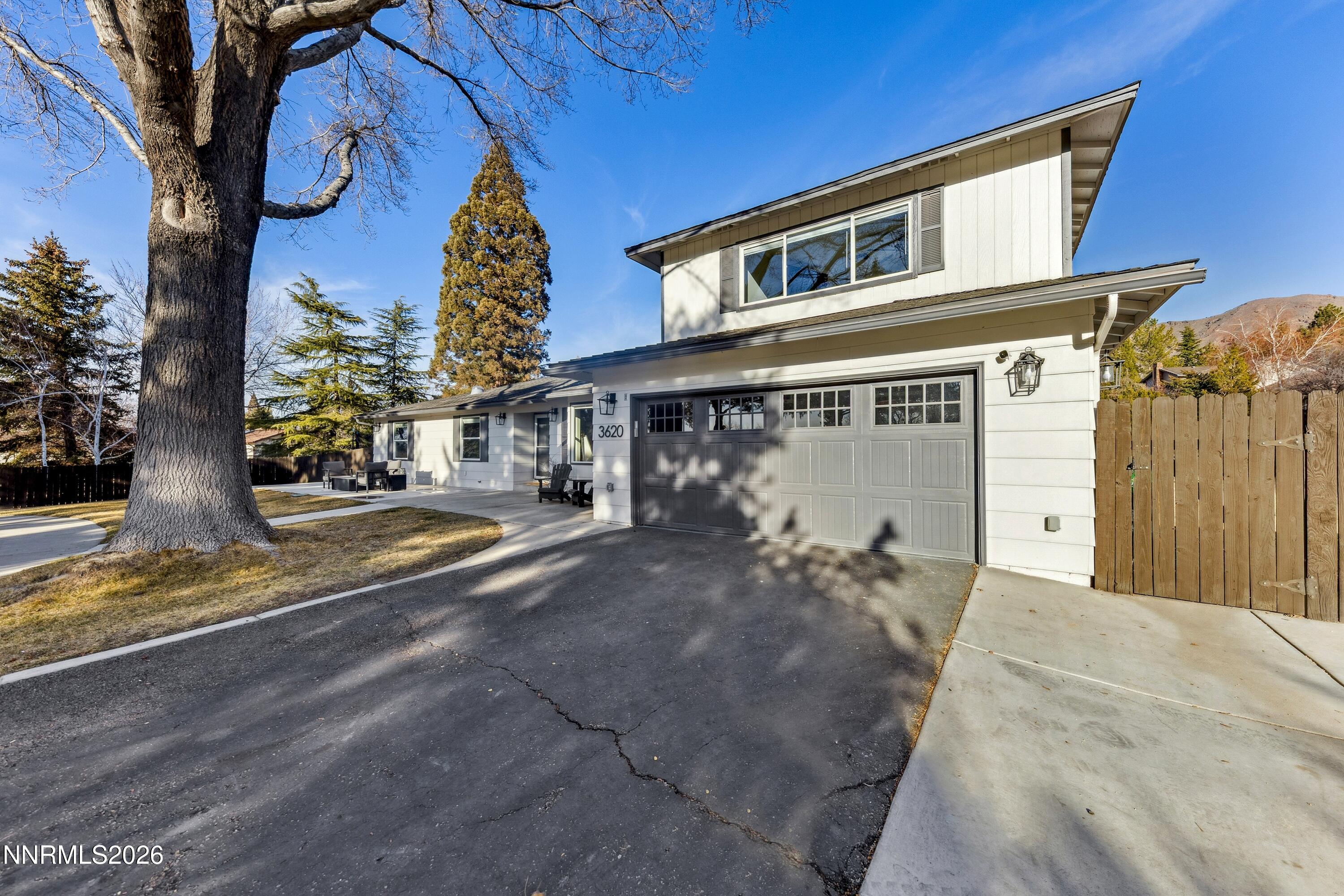 3620 East Hidden Valley Drive Reno, NV 89502 - Photo 14 of 67 a front view of a house with a yard