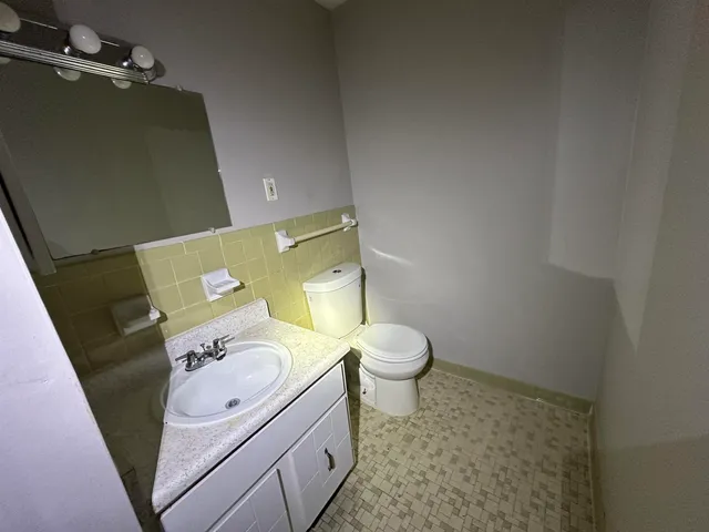 a bathroom with a toilet and a sink