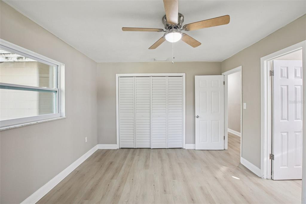 204 East Shell Point Road Ruskin, FL 33570 - Photo 16 of 48 an empty room with windows and fan
