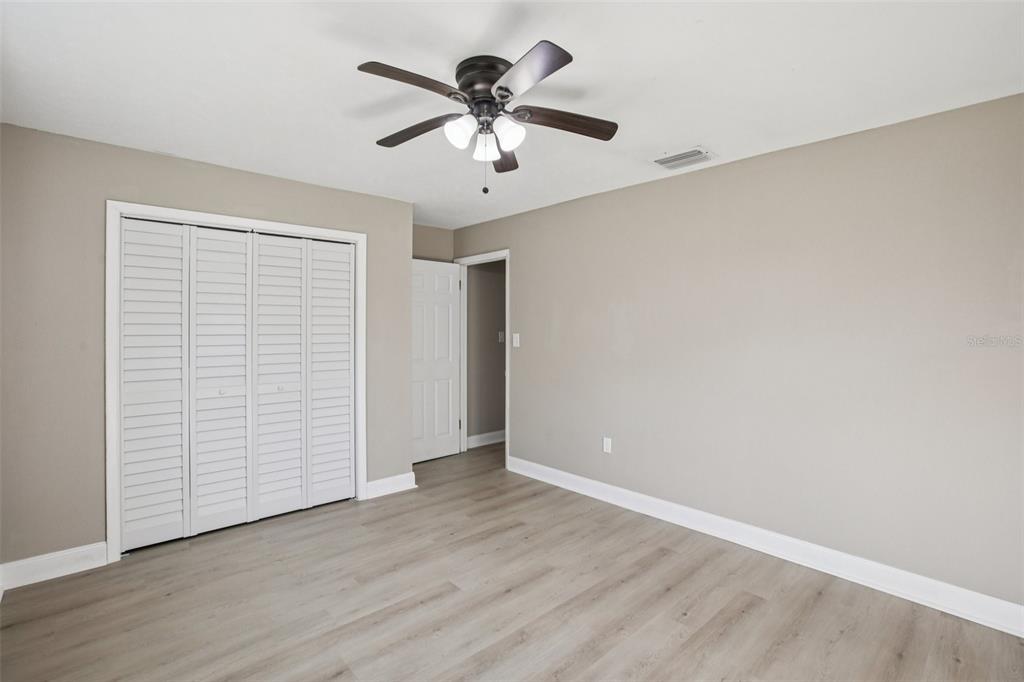 204 East Shell Point Road Ruskin, FL 33570 - Photo 18 of 48 wooden floor in an empty room with a window