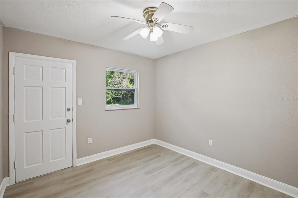 204 East Shell Point Road Ruskin, FL 33570 - Photo 21 of 48 an empty room with windows and fan