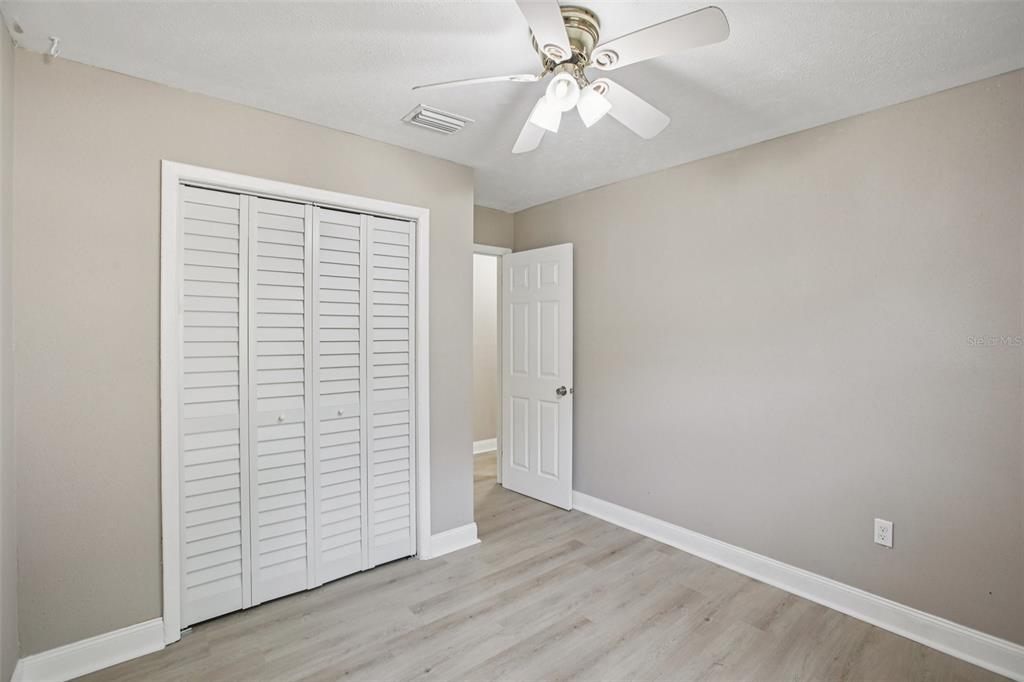 204 East Shell Point Road Ruskin, FL 33570 - Photo 24 of 48 wooden floor in an empty room with a window