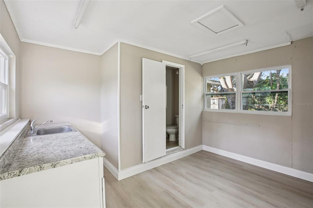 204 East Shell Point Road Ruskin, FL 33570 - Photo 26 of 48 a bathroom with a granite countertop sink and a mirror