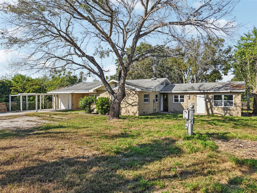 204 East Shell Point Road Ruskin, FL 33570 - Photo 41 of 48 a front view of a house with a yard
