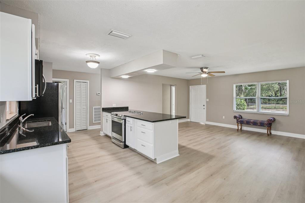 204 East Shell Point Road Ruskin, FL 33570 - Photo 9 of 48 a view of kitchen with sink and wooden floor