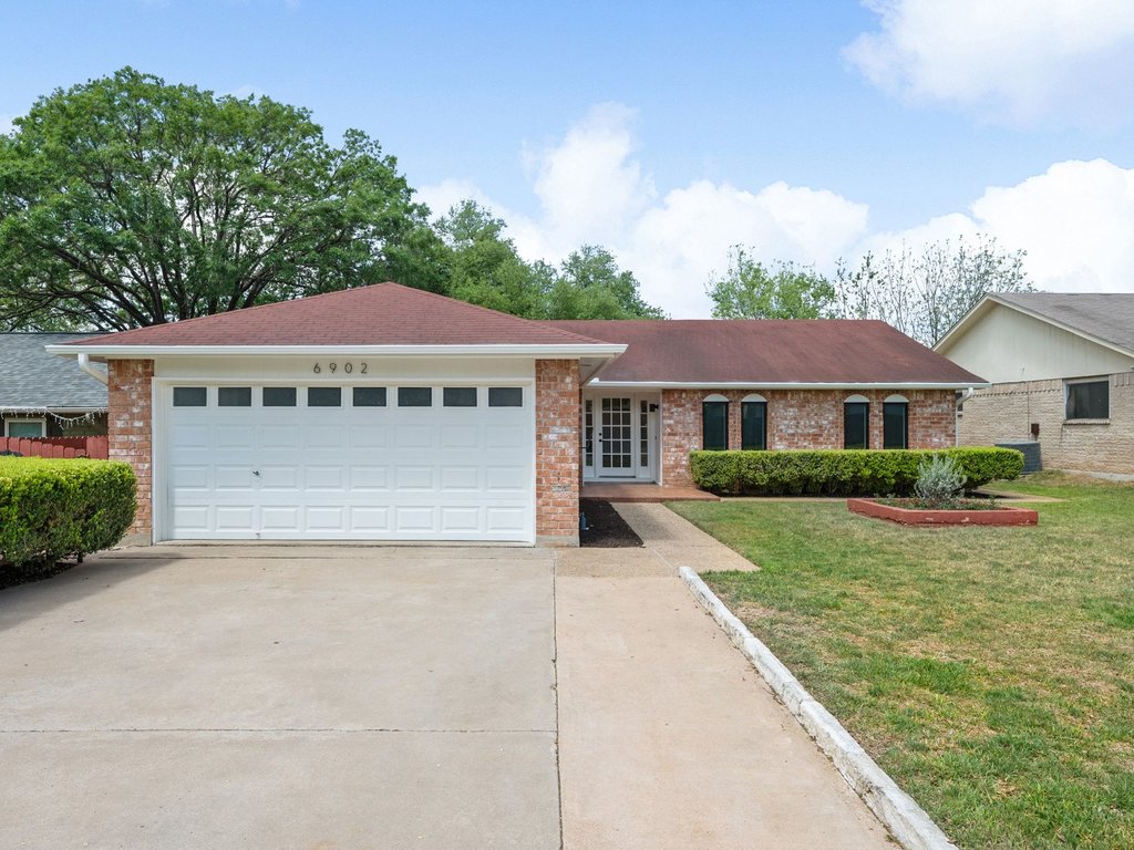 a front view of a house with yard