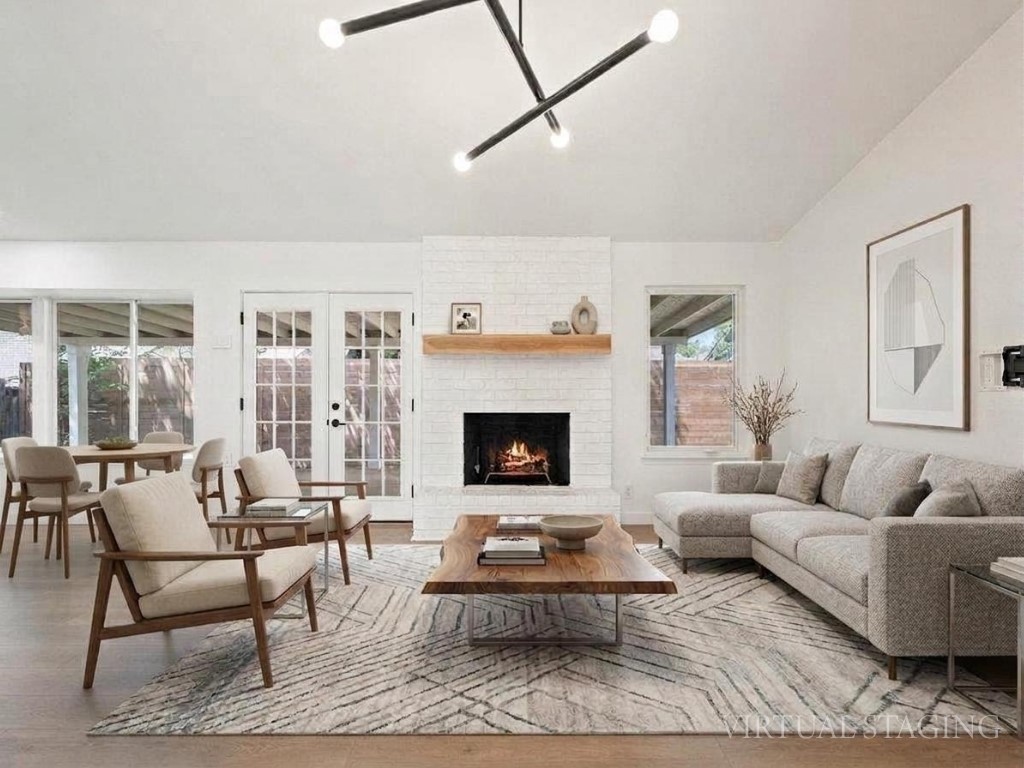 6902 Meadow Run Austin, TX 78745 - Photo 2 of 33 a living room with furniture and a fireplace