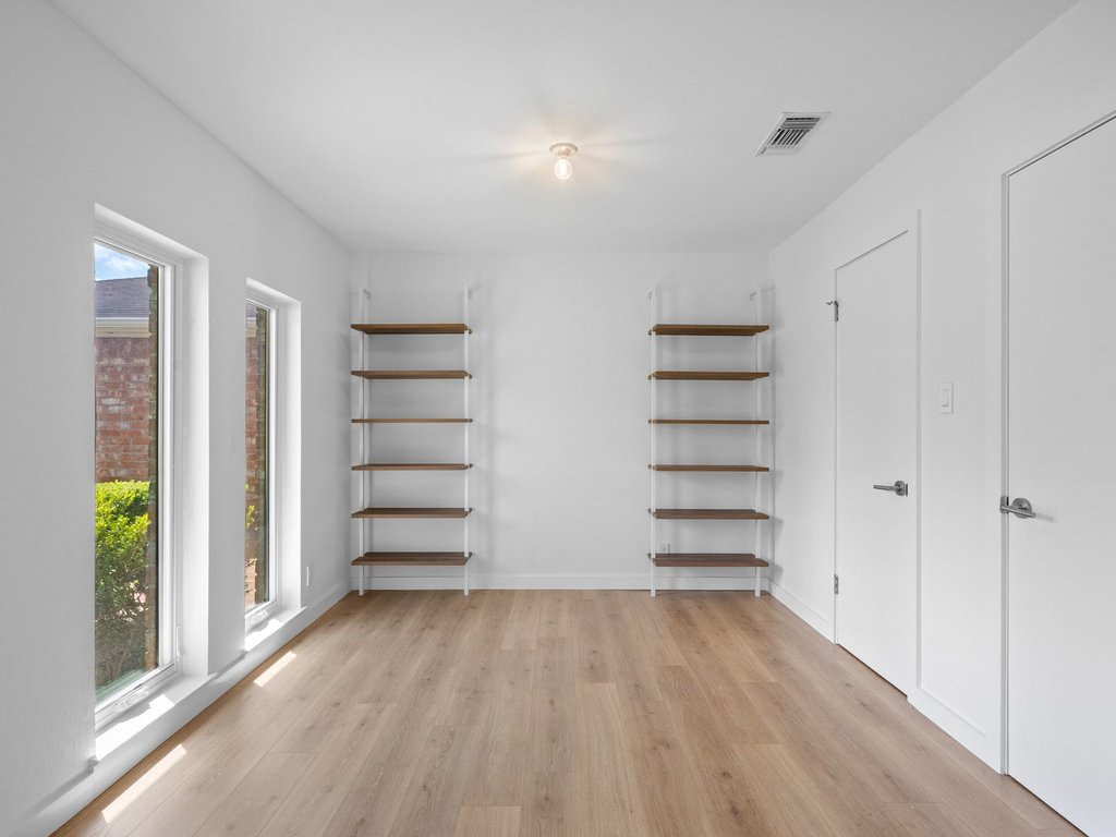 6902 Meadow Run Austin, TX 78745 - Photo 21 of 33 a view of walk in closet with empty racks