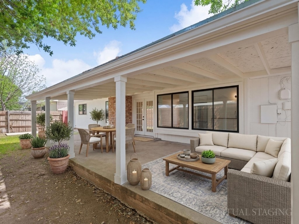 6902 Meadow Run Austin, TX 78745 - Photo 26 of 33 a patio with patio table and chairs