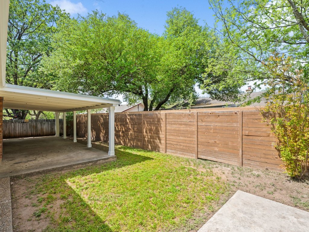 6902 Meadow Run Austin, TX 78745 - Photo 30 of 33 Fenced backyard featuring a patio