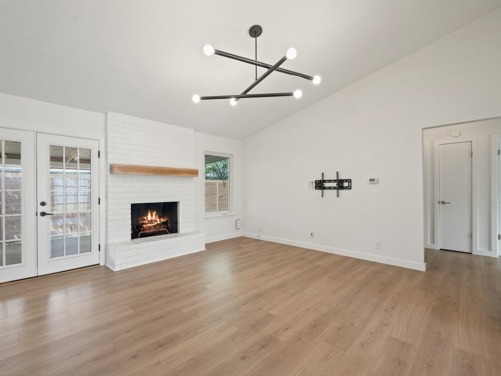 6902 Meadow Run Austin, TX 78745 - Photo 7 of 33 a view of an empty room with a fireplace