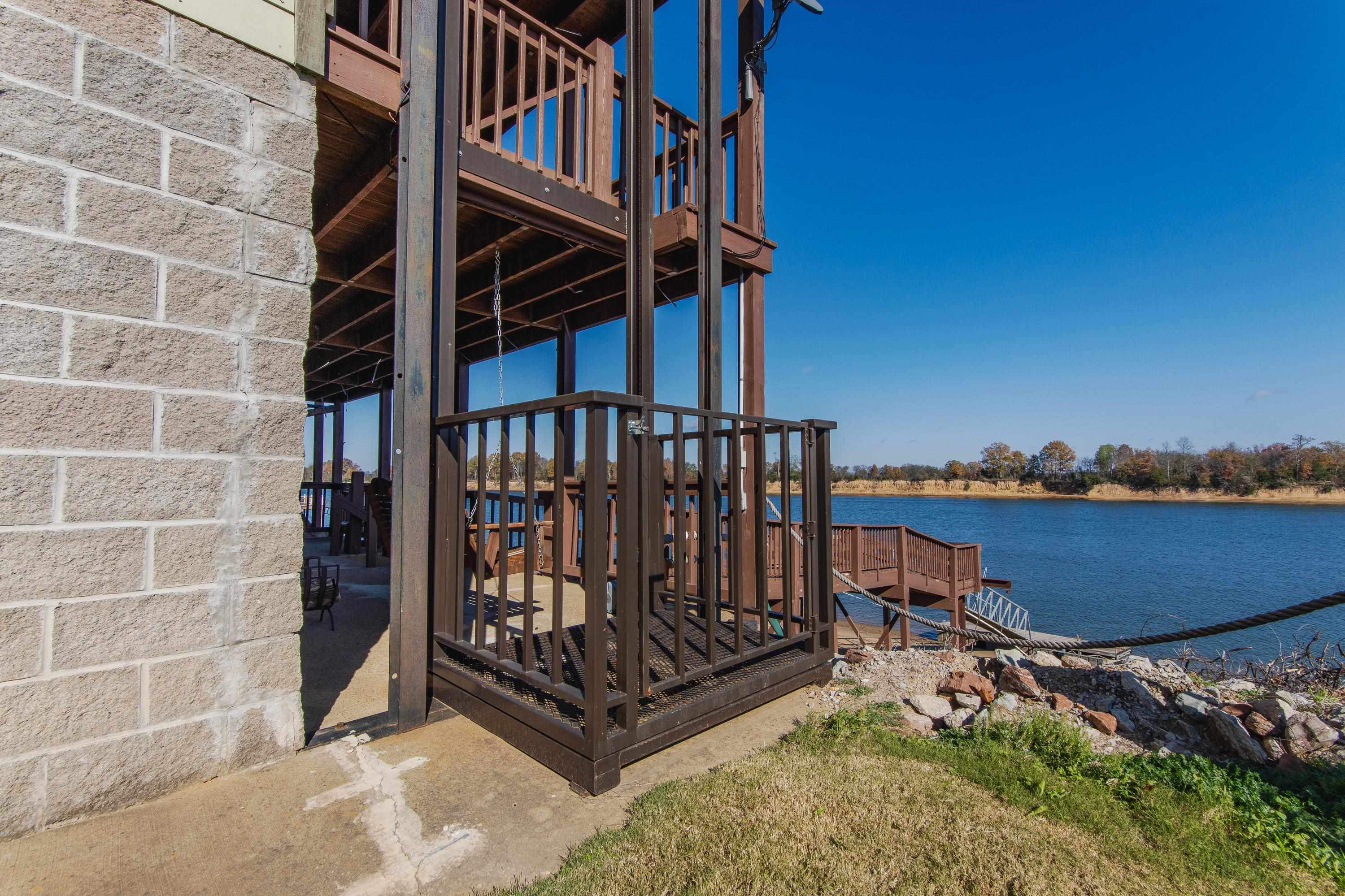 1111 Leaning Trees Lane Adamsville, TN 38310 - Photo 25 of 36 View of dock with a water view