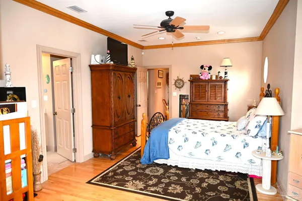 a living room with furniture and a book shelf