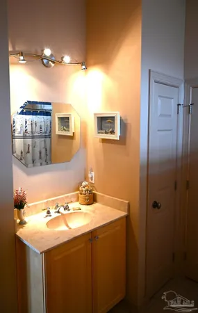a bathroom with a sink a vanity and a mirror