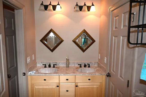 a bathroom with a shower and a sink