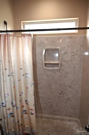 a living room with a sink and a washer dryer