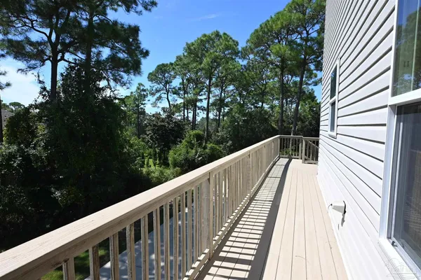 a view of balcony with furniture