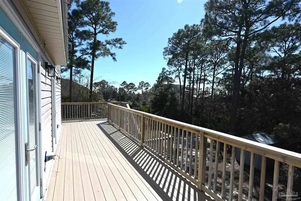 a view of a porch with wooden floor