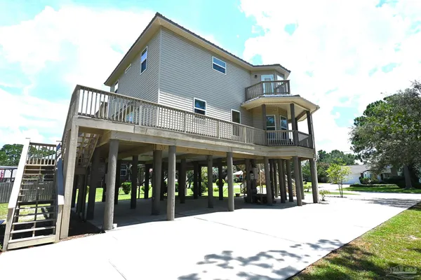 a view of a livingroom with furniture window and wooden floor