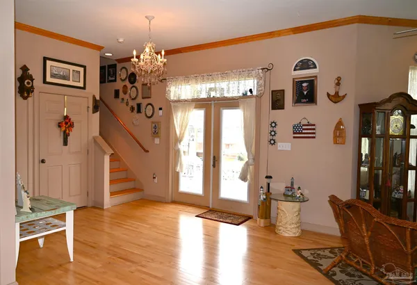 a workspace with wooden floor and furniture