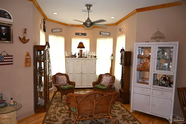a kitchen with stainless steel appliances granite countertop a sink dishwasher and a refrigerator with wooden floor