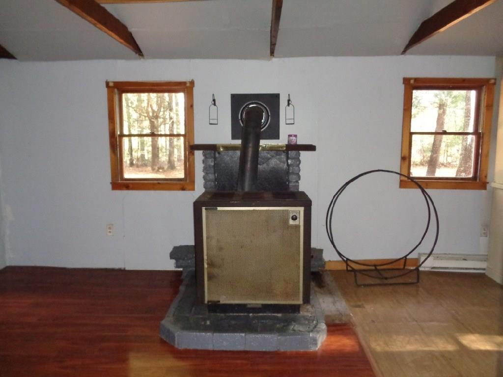 880 Winding Hill Road Norridgewock, ME 04957 - Photo 7 of 12 Wood Stove in the living room