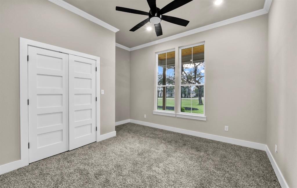 2016 Forest Bridge Azle, TX 76020 - Photo 16 of 16 Unfurnished bedroom featuring crown molding, carpet floors, a closet, a ceiling fan, and recessed lighting