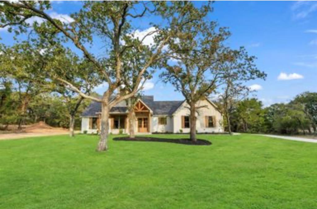 2016 Forest Bridge Azle, TX 76020 - Photo 2 of 16 View of front of house featuring a front lawn