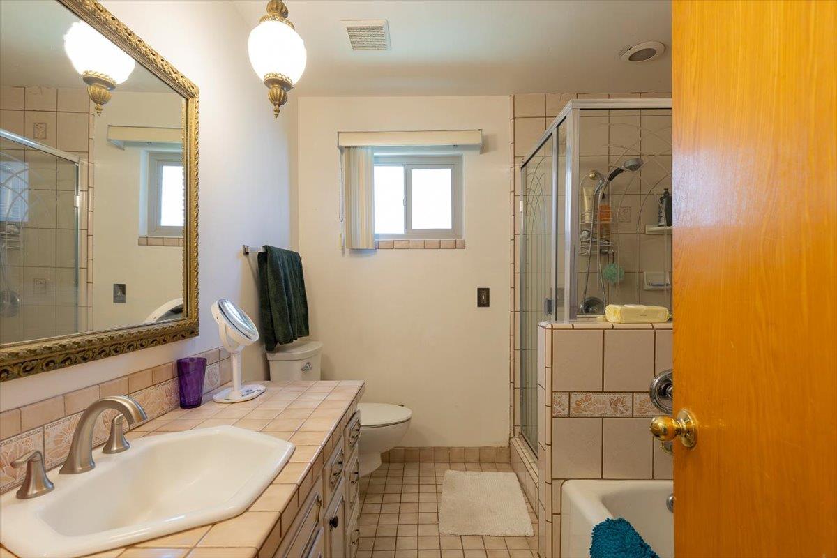 69 Springbrook Circle Sacramento, CA 95831 - Photo 22 of 29 a bathroom with a sink and a mirror