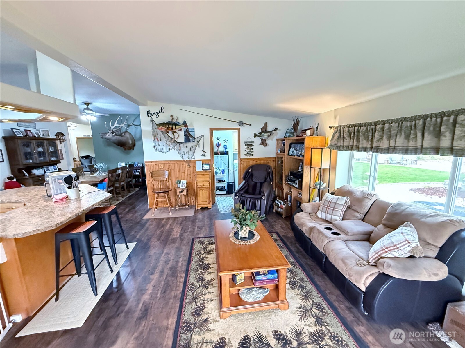 92 Crumbacher Road Tonasket, WA 98855 - Photo 12 of 40 a living room with furniture and a large window