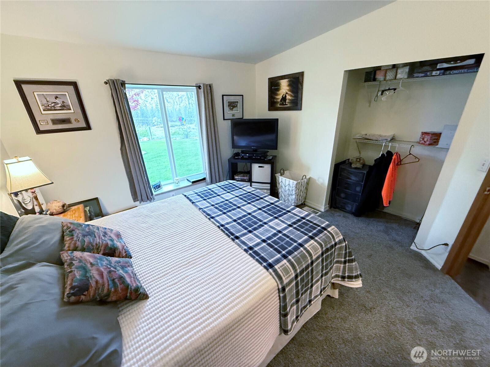 92 Crumbacher Road Tonasket, WA 98855 - Photo 19 of 40 a bedroom with a bed and a couch
