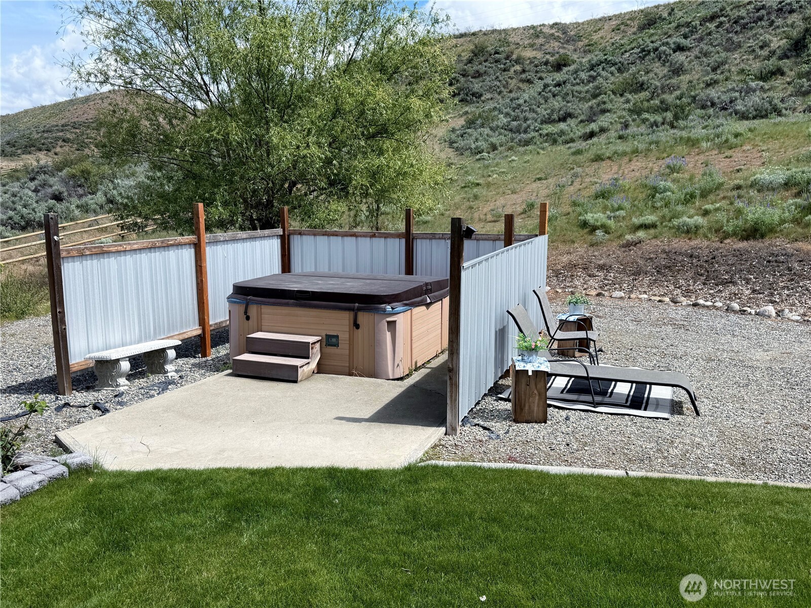 92 Crumbacher Road Tonasket, WA 98855 - Photo 24 of 40 a view of a backyard with a wooden fence