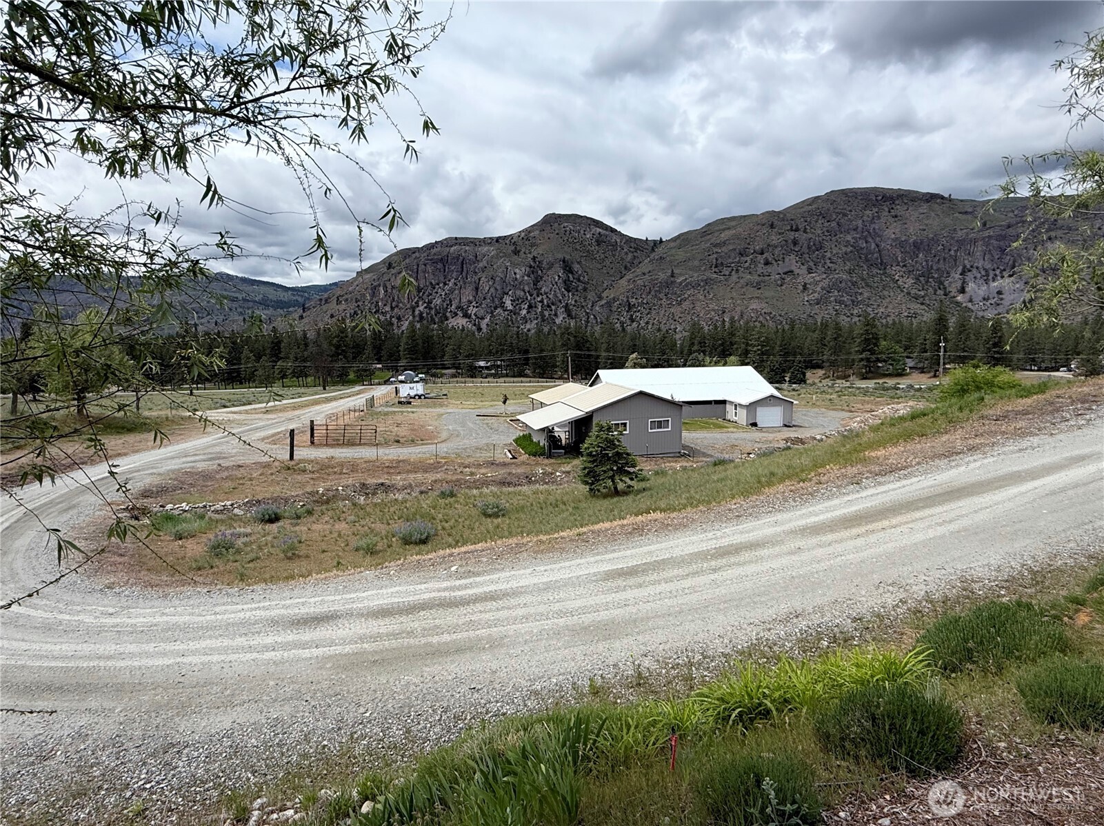 92 Crumbacher Road Tonasket, WA 98855 - Photo 29 of 40 a view of a houses with a yard