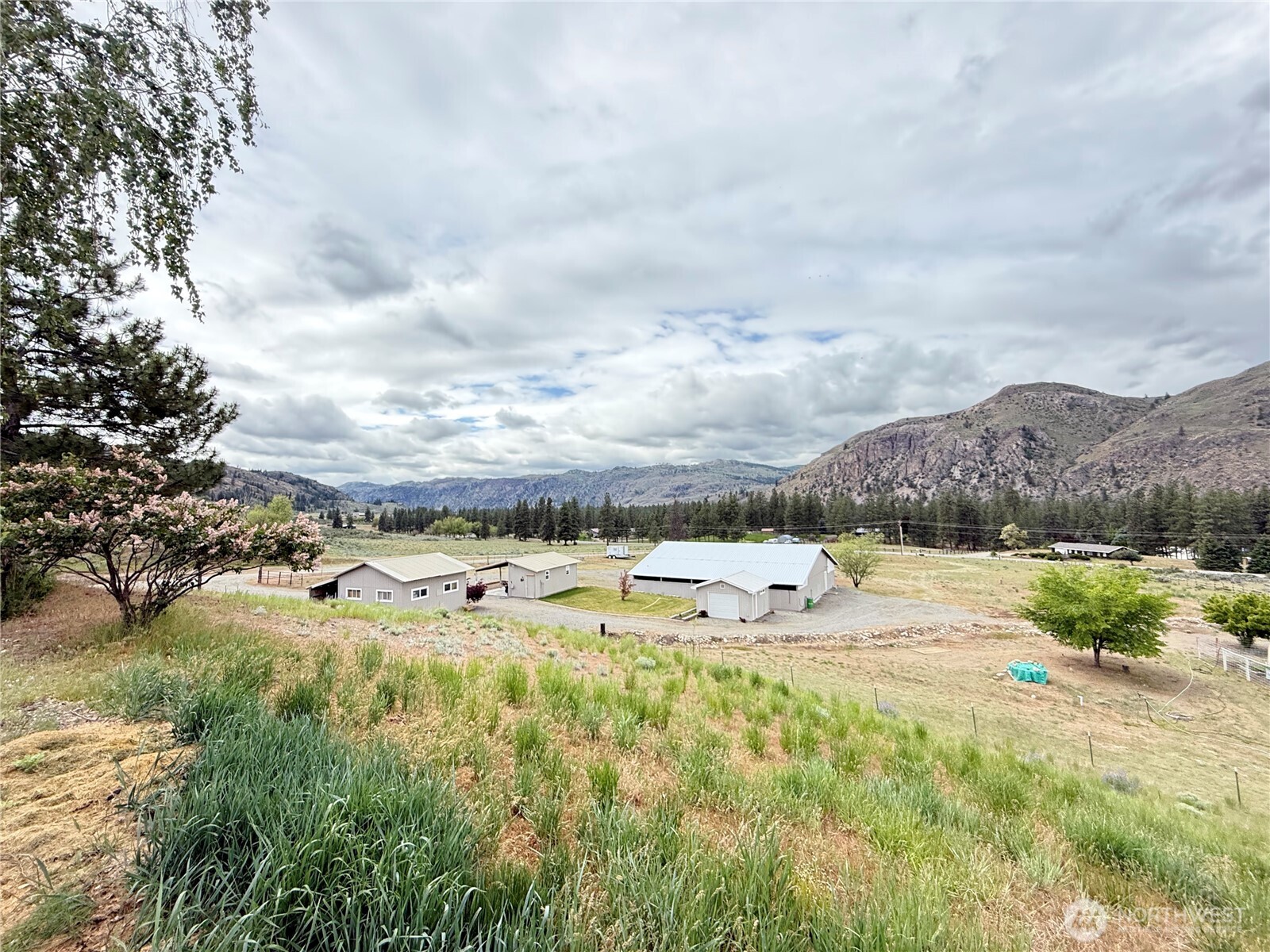 92 Crumbacher Road Tonasket, WA 98855 - Photo 30 of 40 a view of a lake with houses in the back