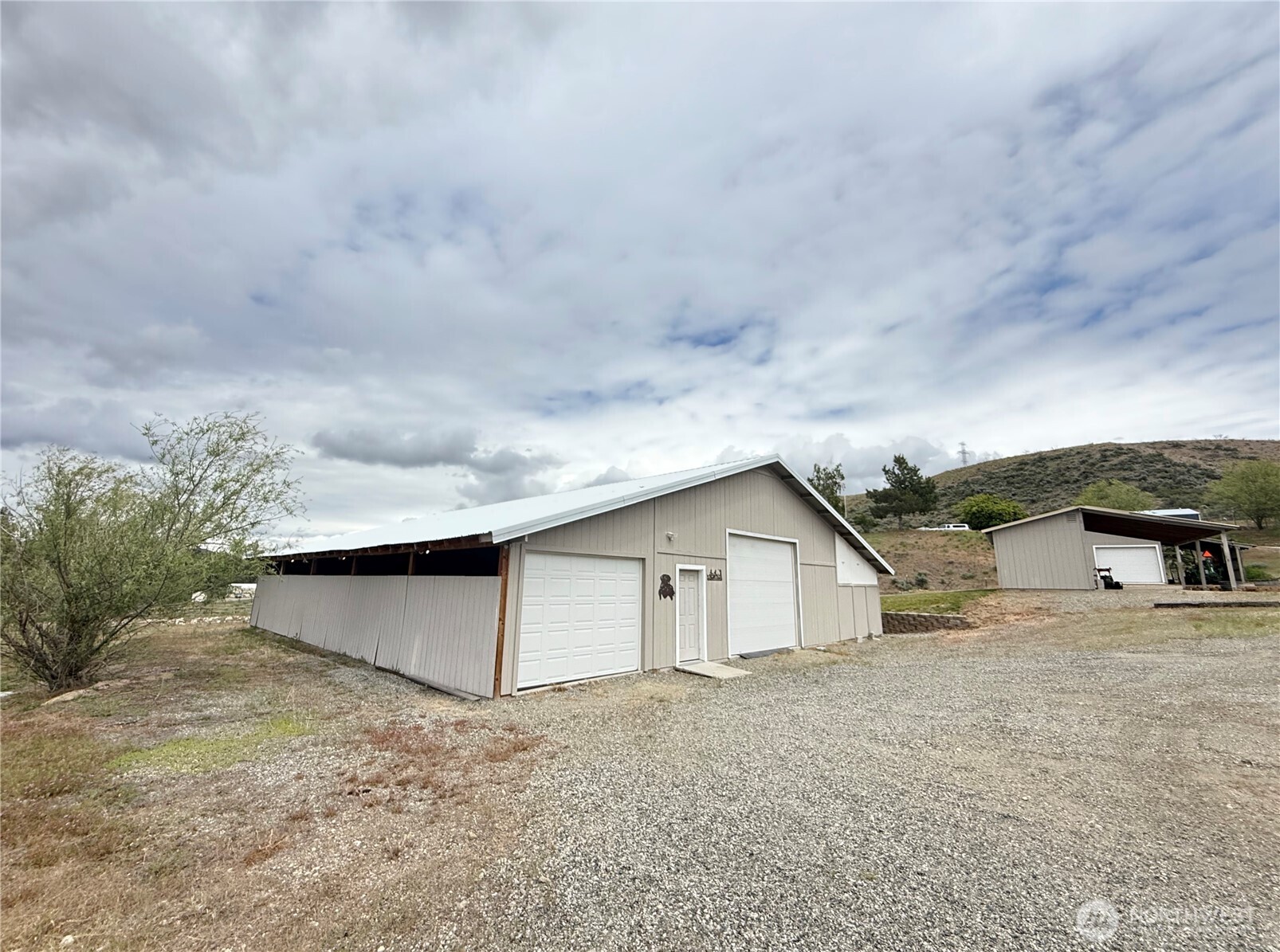 92 Crumbacher Road Tonasket, WA 98855 - Photo 3 of 40 a view of a house with a sink and wooden fence