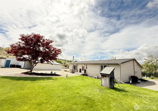 a view of a house with pool porch and sitting area