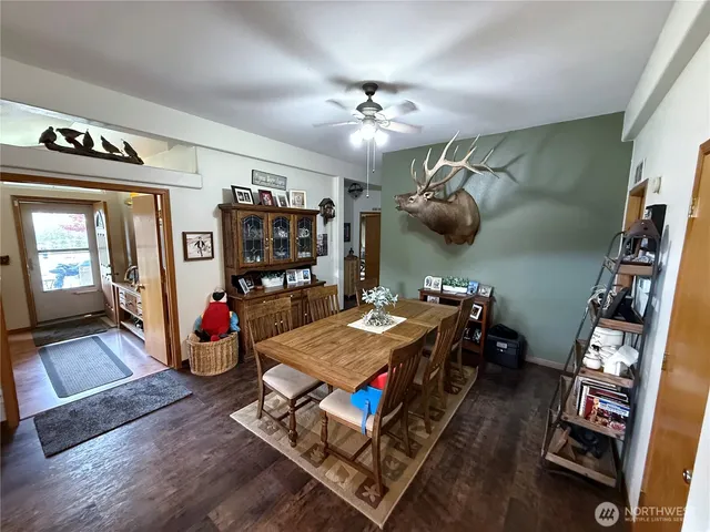 a bedroom with furniture and wooden floor