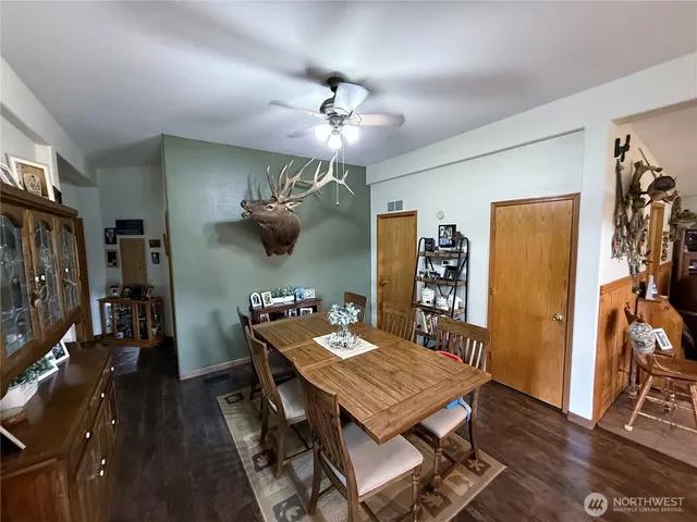 a view of a dining room with furniture and wooden floor