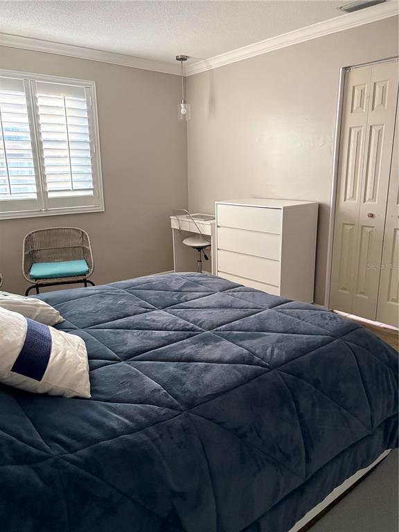 1500 Gay Road, Unit 20D Winter Park, FL 32789 - Photo 11 of 22 a bedroom with a bed and window