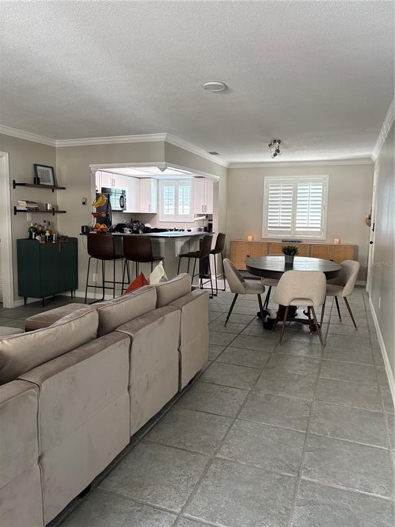 1500 Gay Road, Unit 20D Winter Park, FL 32789 - Photo 7 of 22 a living room with furniture and a fireplace