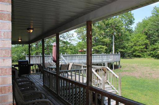 2344 Doyle Frazier Road Morrison, TN 37357 - Photo 16 of 24 Back porch with attached deck. There is an above ground pool but it needs a new liner.