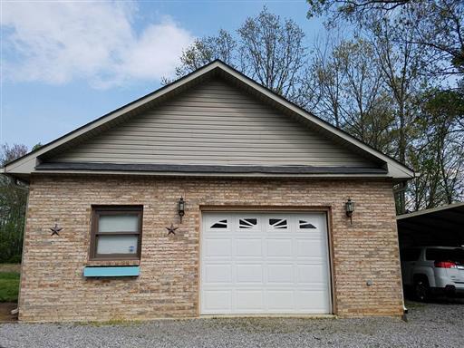 2344 Doyle Frazier Road Morrison, TN 37357 - Photo 17 of 24 Detached brick garage/workshop could also be converted to an apartment cause it has it's own full bath, kitchenette and is heated & cooled with it's own meter.