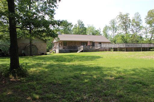 2344 Doyle Frazier Road Morrison, TN 37357 - Photo 19 of 24 Looking at the back of the house from the tree-lined back yard. Lots more property farther back including a stocked pond.
