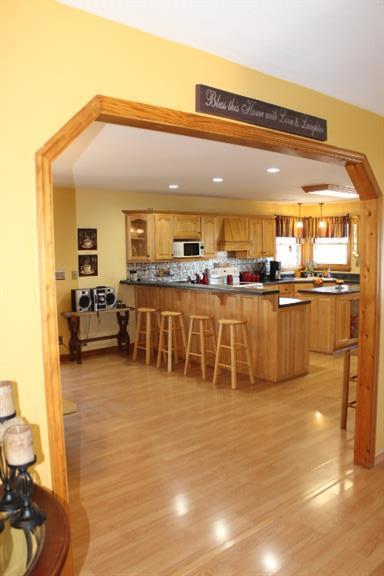 2344 Doyle Frazier Road Morrison, TN 37357 - Photo 7 of 24 from foyer looking into this beautiful kitchen with tons of cabinets and counter space and island. Dining area to the left side of this picture.