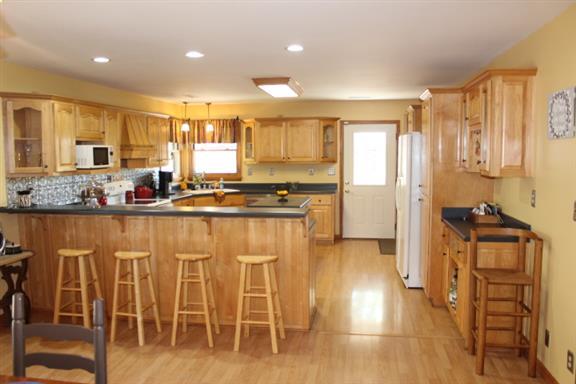 2344 Doyle Frazier Road Morrison, TN 37357 - Photo 8 of 24 Eat at bar and built in wine rack. Tons of counter space and cabinetry. Recessed lights with dimmer.