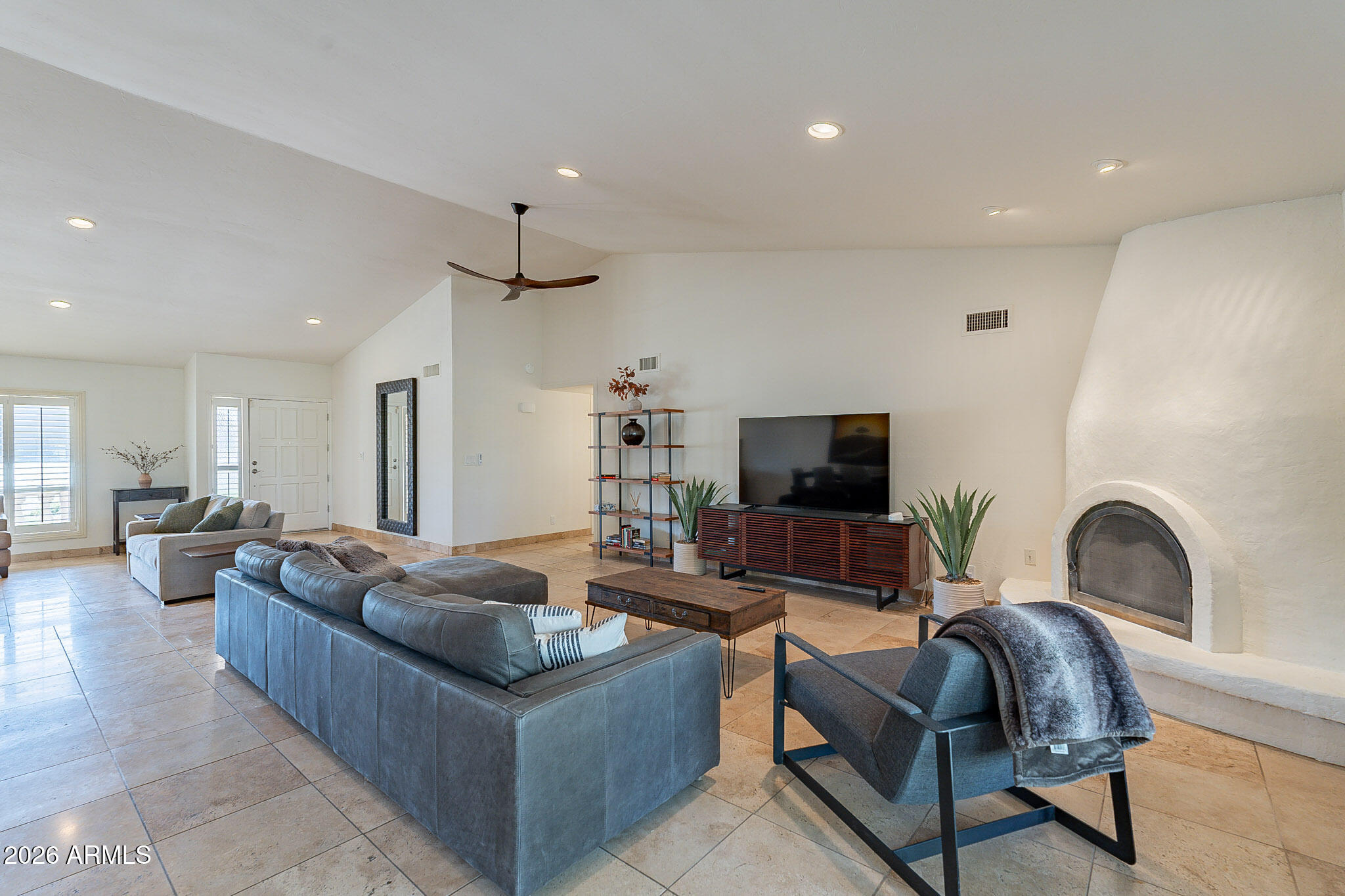 4226 East North Lane Phoenix, AZ 85028 - Photo 12 of 43 a living room with furniture and a flat screen tv