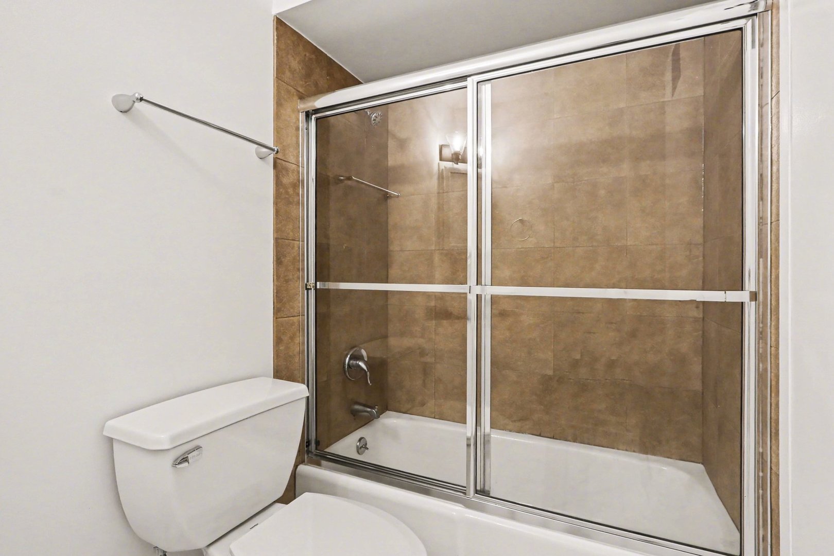 20 North Tower Road, Unit 4C Oak Brook, IL 60523 - Photo 14 of 16 a bathroom with a shower and toilet