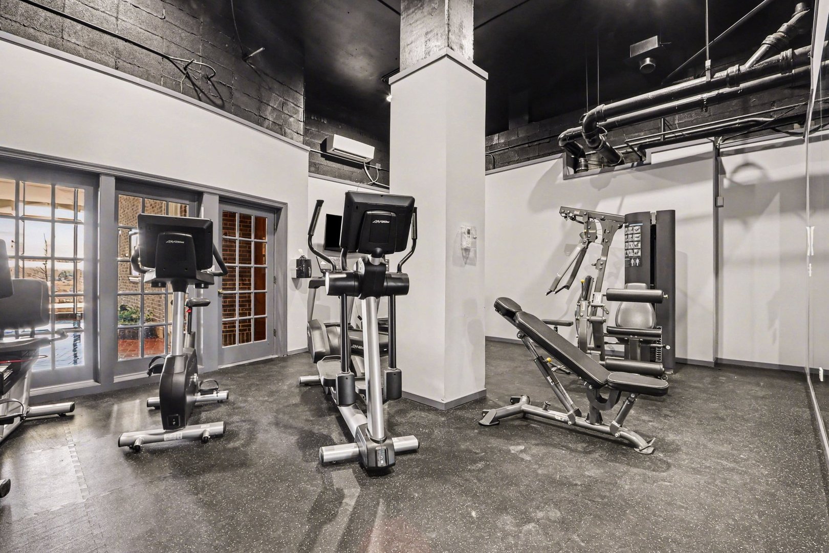 20 North Tower Road, Unit 4C Oak Brook, IL 60523 - Photo 4 of 16 a view of a room with gym equipment
