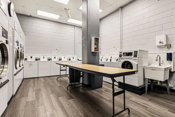 a room with table chairs and a stove