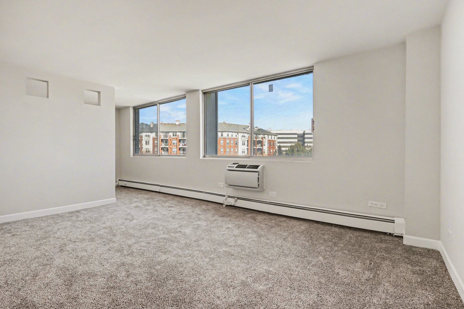 20 North Tower Road, Unit 4C Oak Brook, IL 60523 - Photo 7 of 16 an empty room with windows